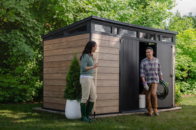 couple outside a signature shed ashwood